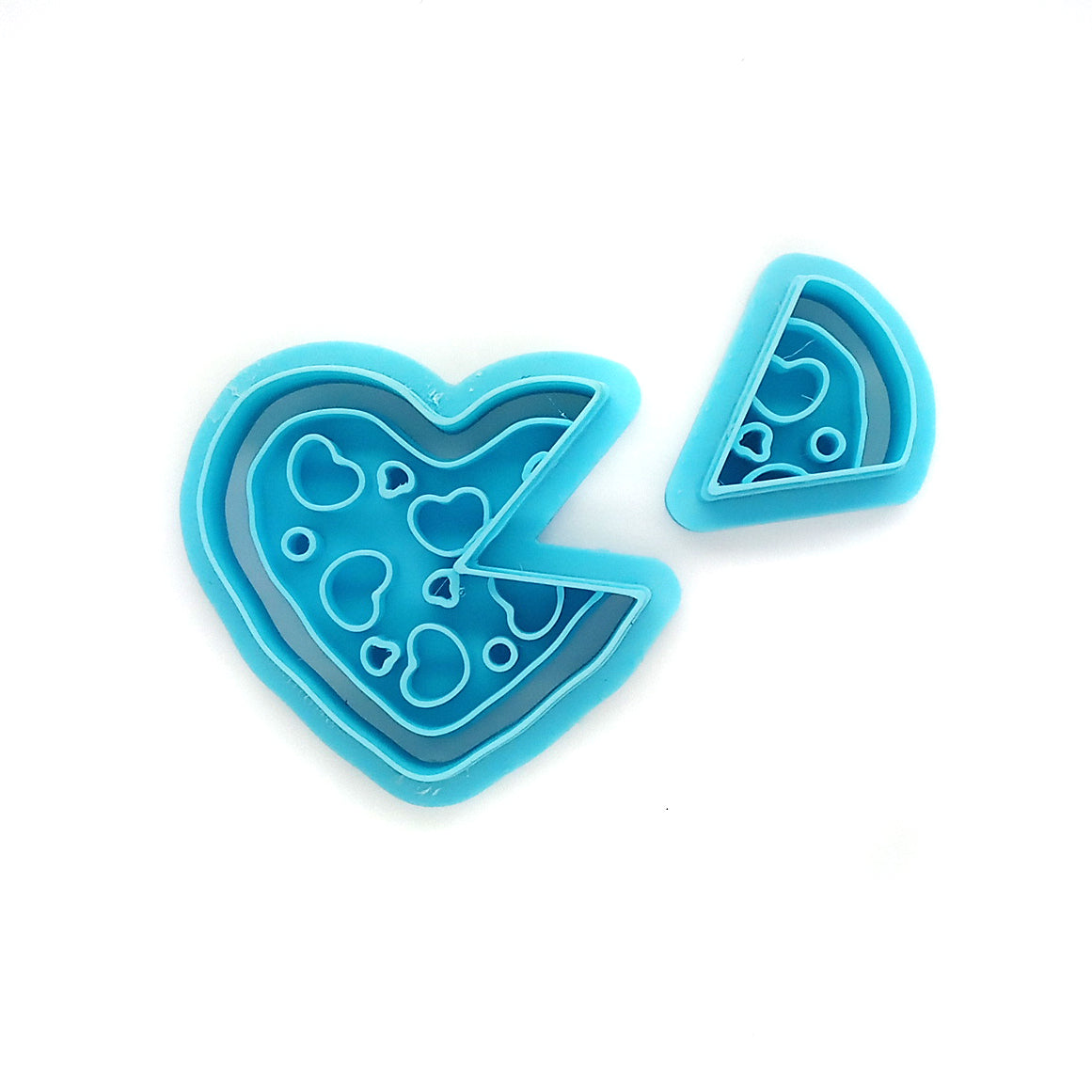 Blue pizza-themed clay cutters on a white background