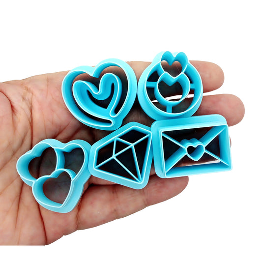 Wedding-themed polymer clay cutters: diamond, ring, invitation and hearts.