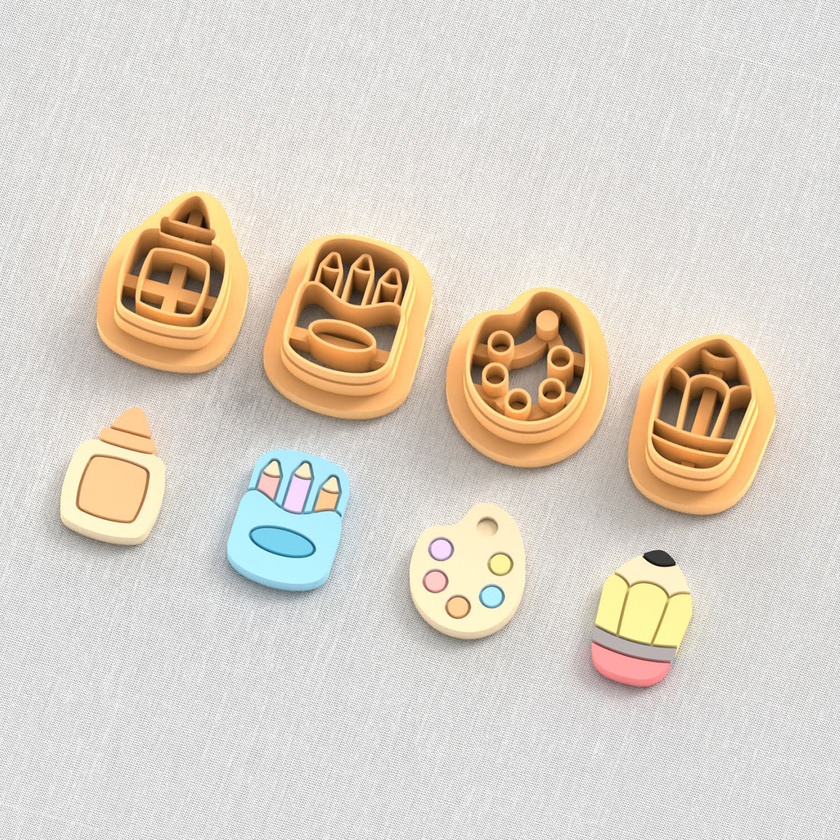 School supplies polymer clay cutters: pencil, paint palette, caryons and glue.