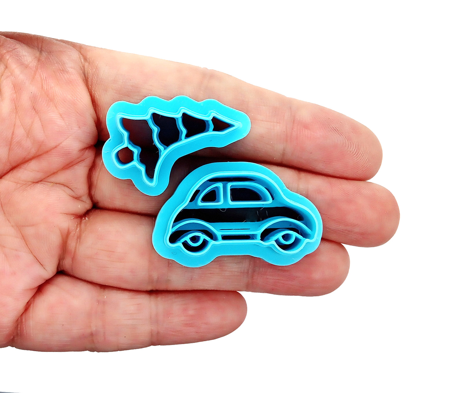 Christmas Clay Cutters, Car with Christmas Tree held in hand, featuring sturdy sharp blades for polymer clay crafting.