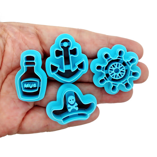 Pirate-themed polymer clay cutter set: ship's wheel, anchor, pirate hat and bottle of rum.