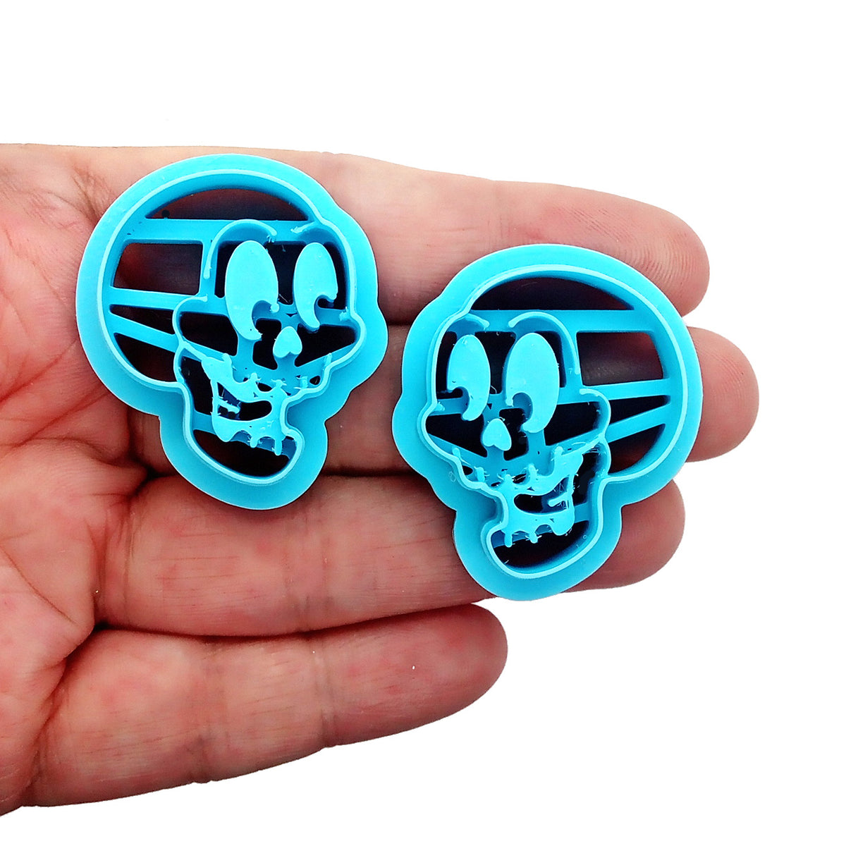Smiling skulls polymer clay cutters.