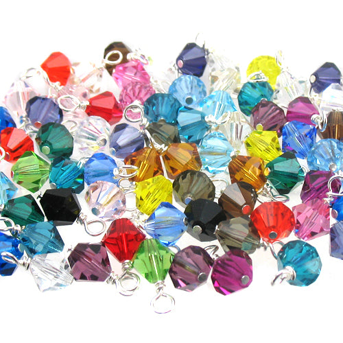 Assorted colorful glass bead charms on a white background, 6mm crystal glass bicone bead dangles.