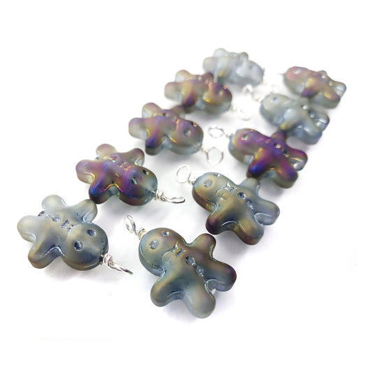 Small charms made from gingerbread boy glass beads.