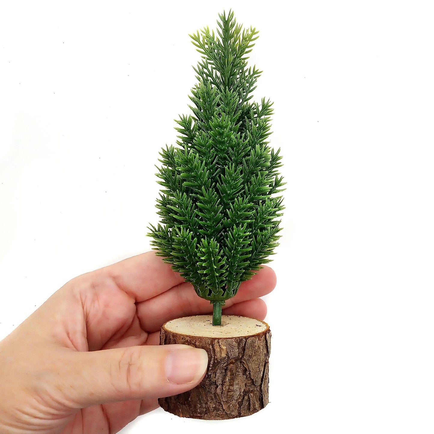 Miniature Christmas tree, 6.5 inches, held in hand.