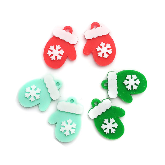 Cute winter mitten charms with snowflakes: red green and mint colored.