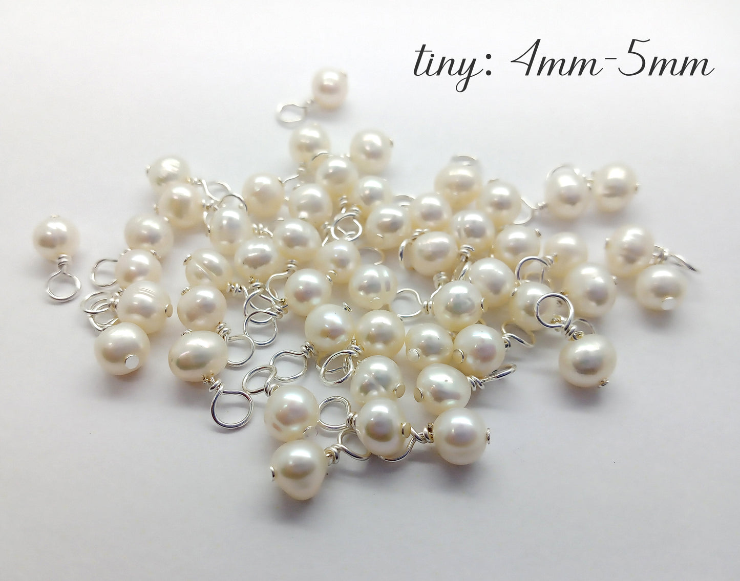 Tiny freshwater pearl charms made from natural pearls and silver-plated jewelry wire.