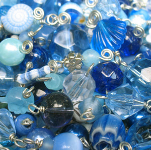 Blue Charm mix of glass, acrylic, and other charm materials.