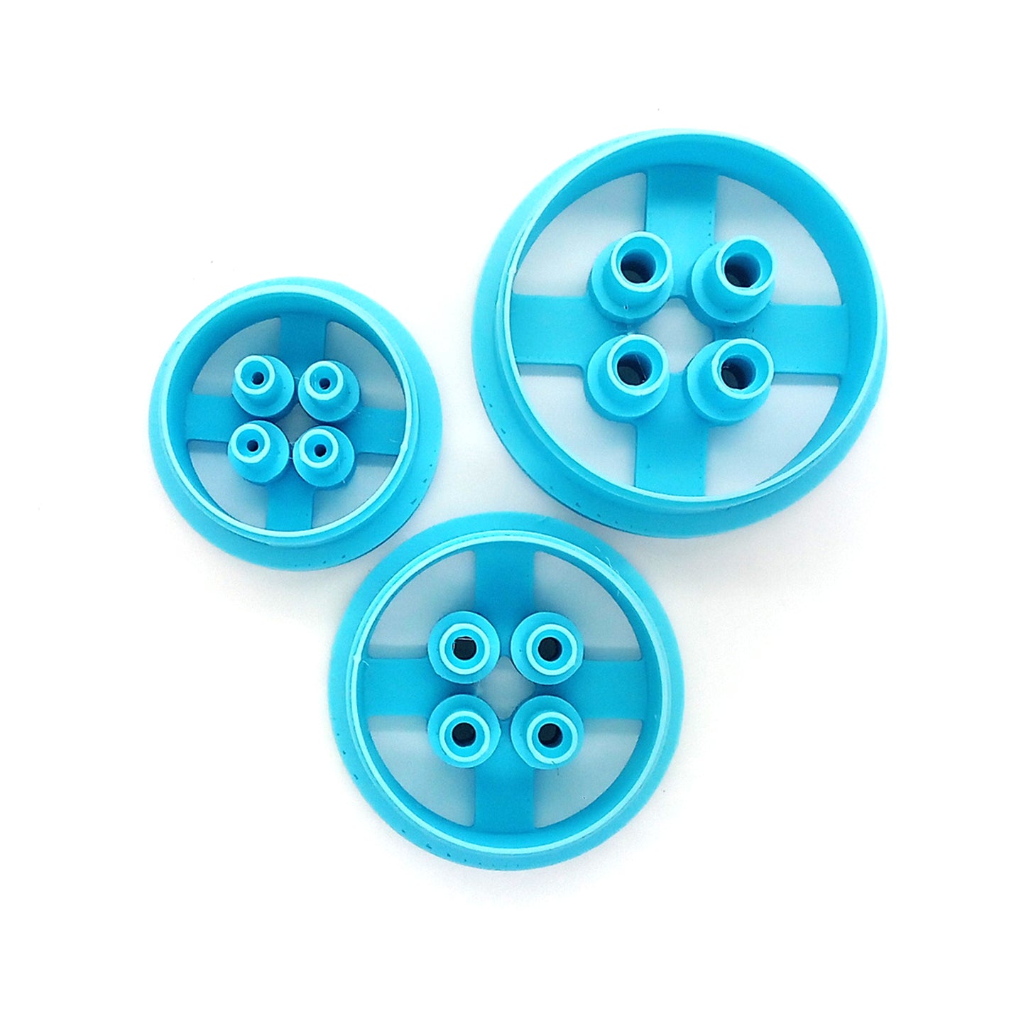 Three button clay cutters in different sizes.
