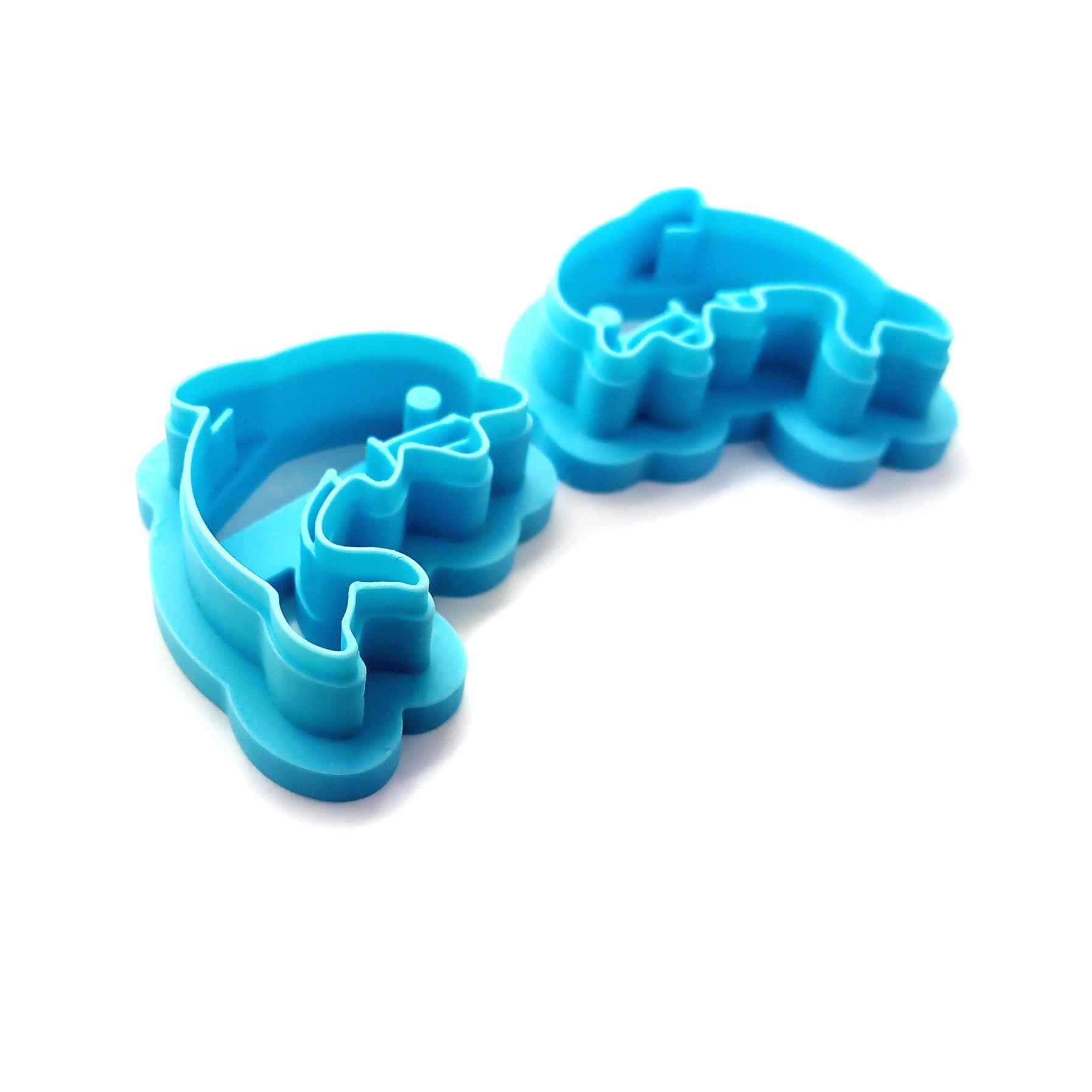 2 mirrored dolphin clay cutters