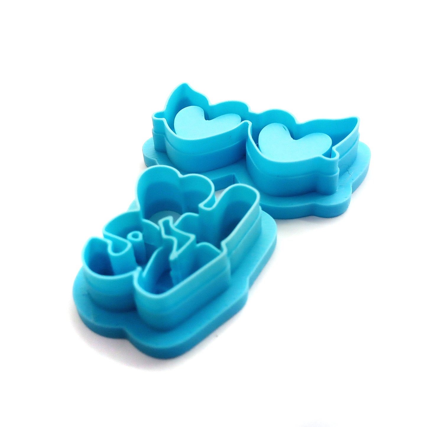 Blue clay cutters with the word "love" and heart-shaped sunglass lenses.