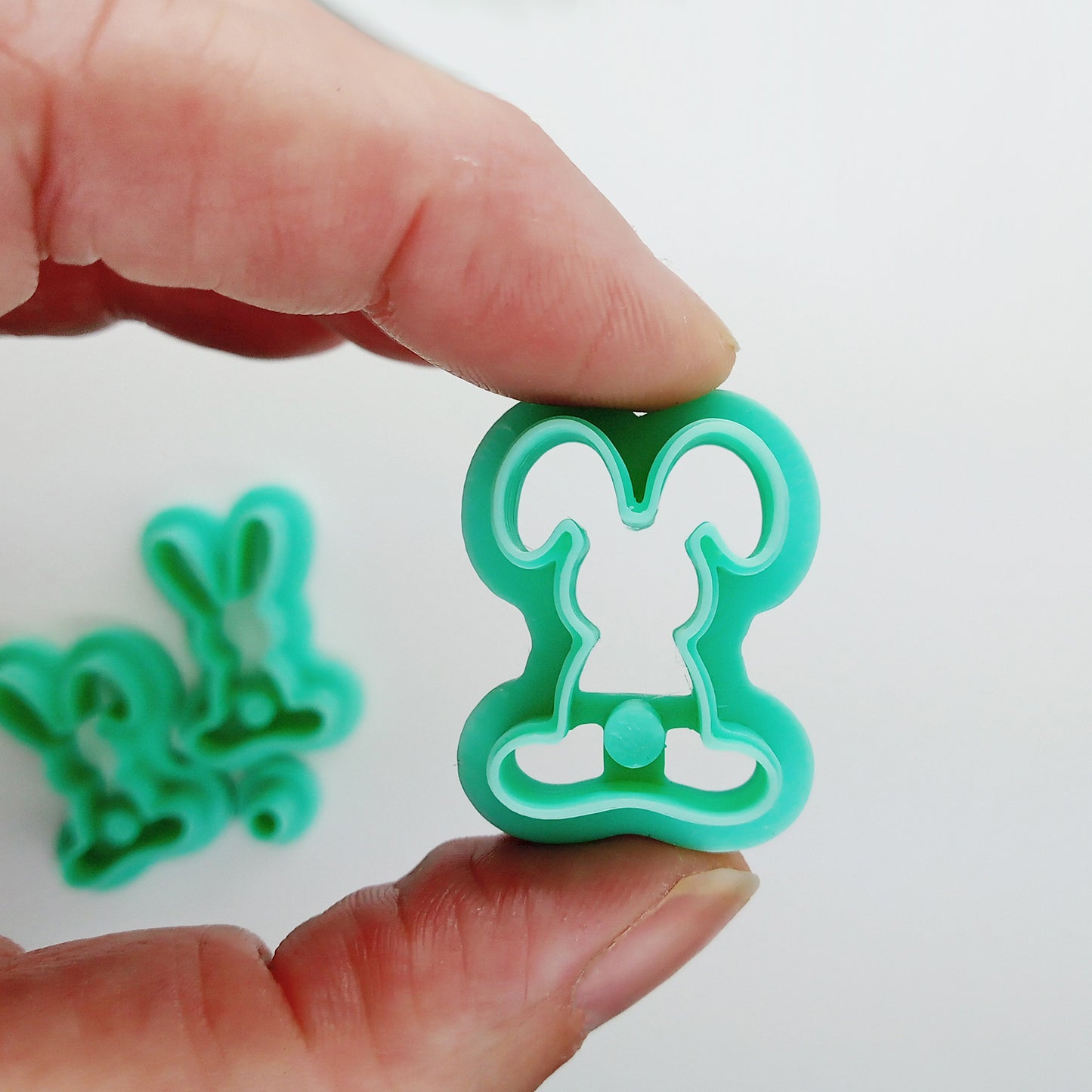 Set of bunny-shaped clay cutters on a white background