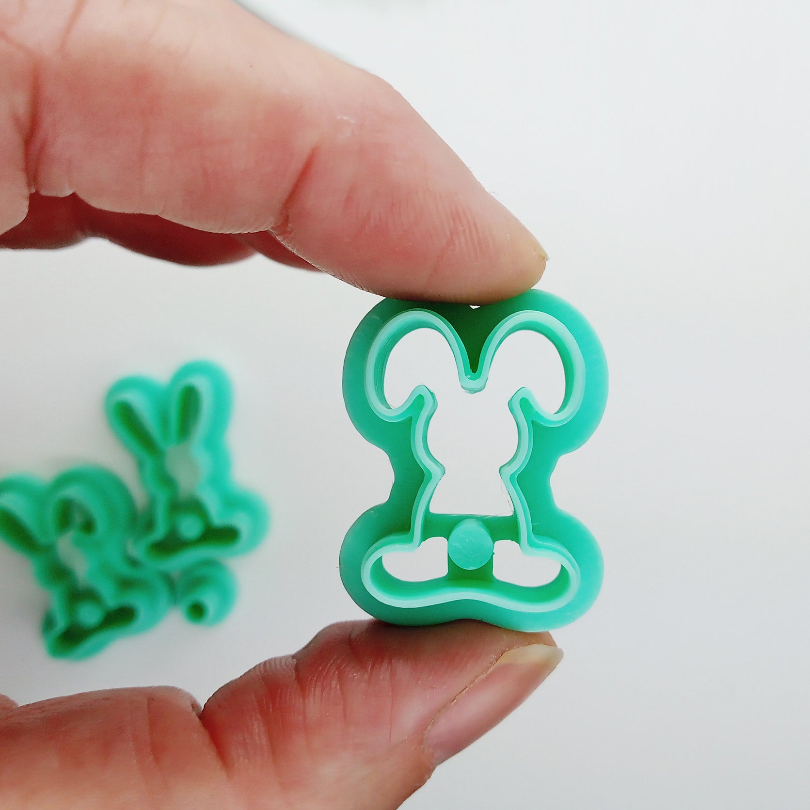 Set of bunny-shaped clay cutters on a white background