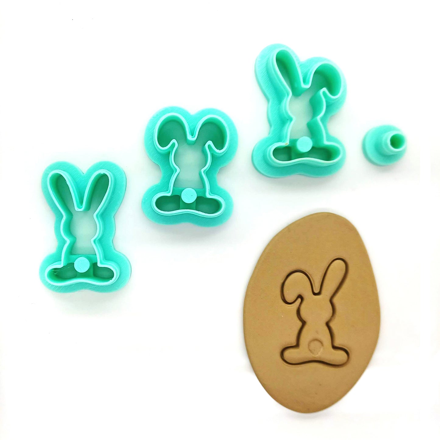 Set of bunny-shaped clay cutters on a white background