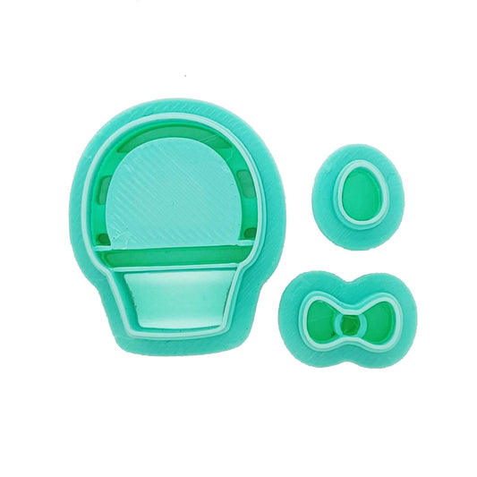 Set of green clay cutters: Easter basket, bow, and tiny egg.