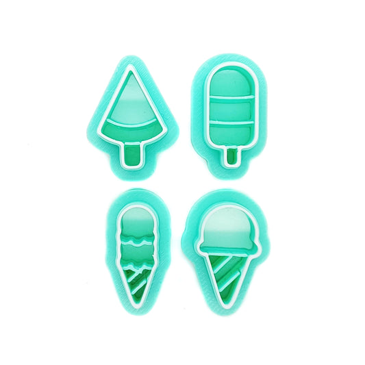 Set of small green clay cutters in ice cream and ice pop shapes