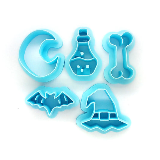 Halloween-themed polymer clay cutter set: moon, potion, bone, bat and witch hat.