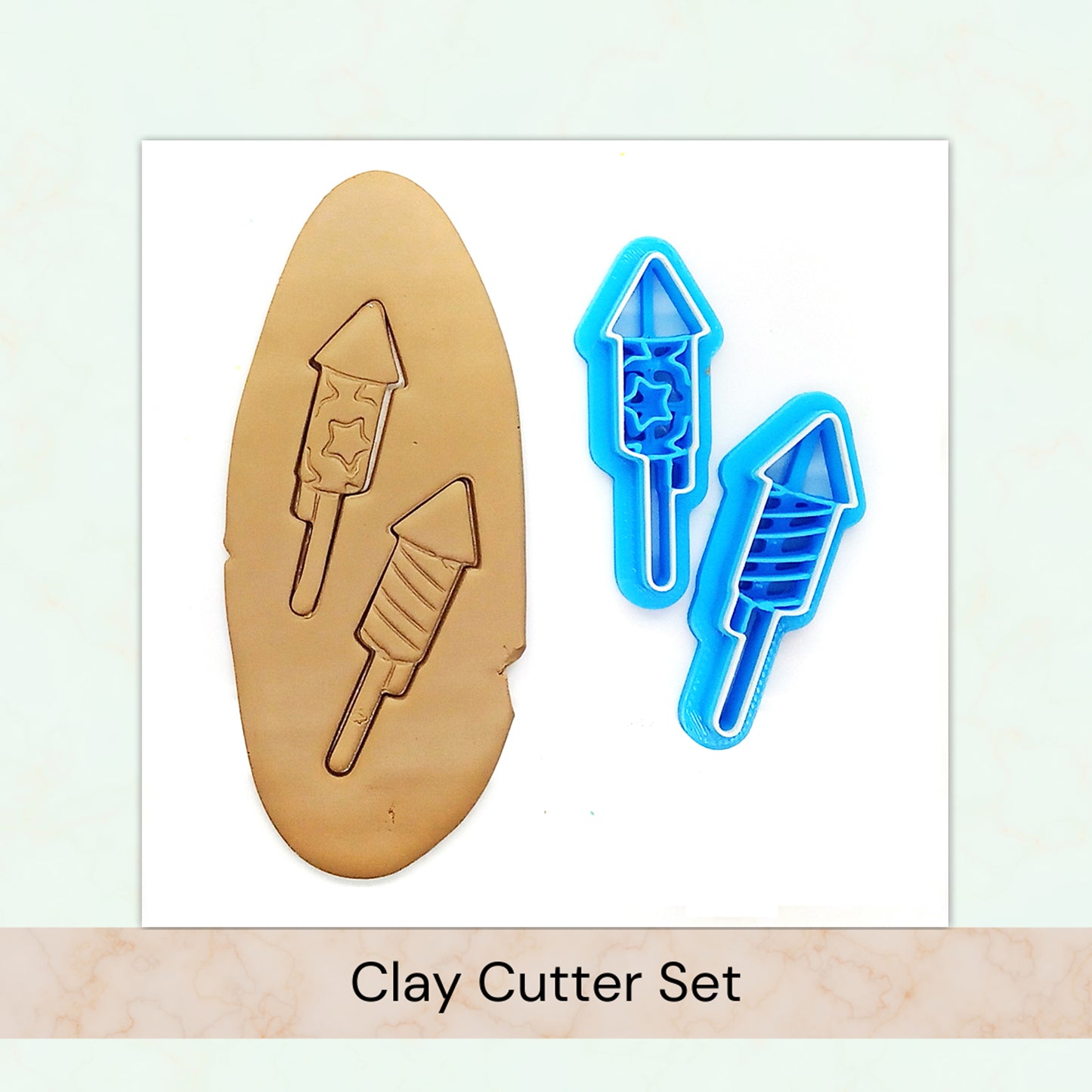 Clay cutter set with two blue fireworks cutters on a white background