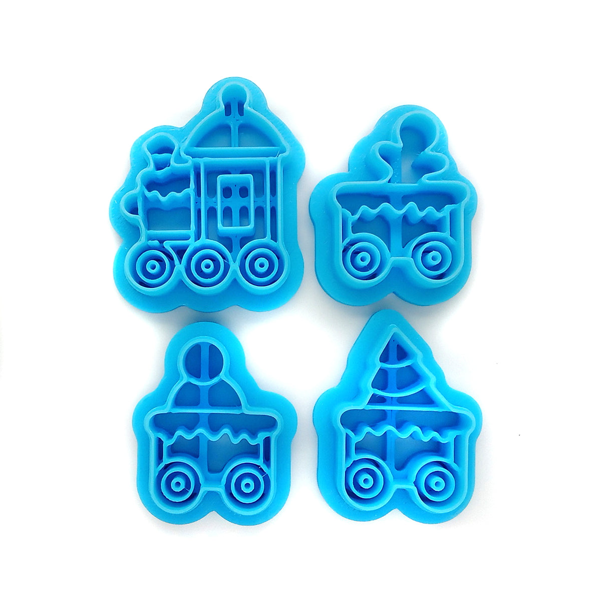 Four bright blue plastic train-shaped clay cutters arranged in a 2x2 grid on a plain white background.