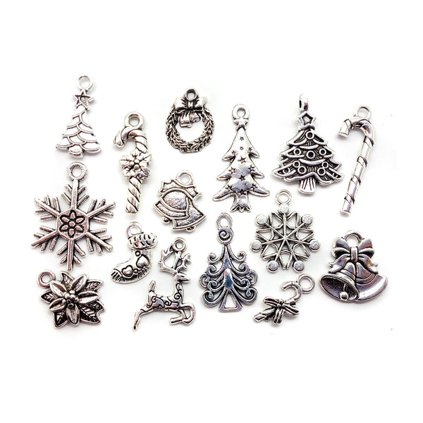Mix of metal Christmas charms in silver-tone alloy: trees, candy canes, stockings, snowflakes pointsettia, reindeer and wreath
