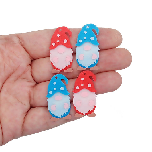 Cute gnome charms, 3D printed in red and blue PLA, with brown shoes and white polka dots.