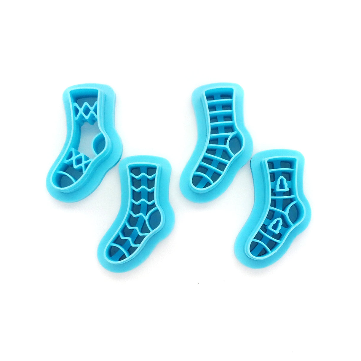 Set of 4 stocking or sock clay cutters in various patterns.