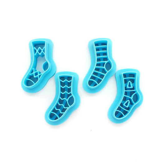 Set of 4 stocking or sock clay cutters in various patterns.