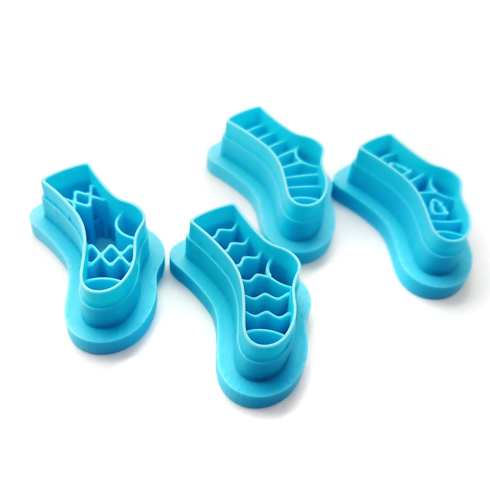 Set of 4 stocking or sock clay cutters in various patterns.