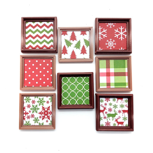 Eight framed Christmas prints for small dollhouses, including snowflakes, plaid, reindeer, polka dots and Christmas trees.