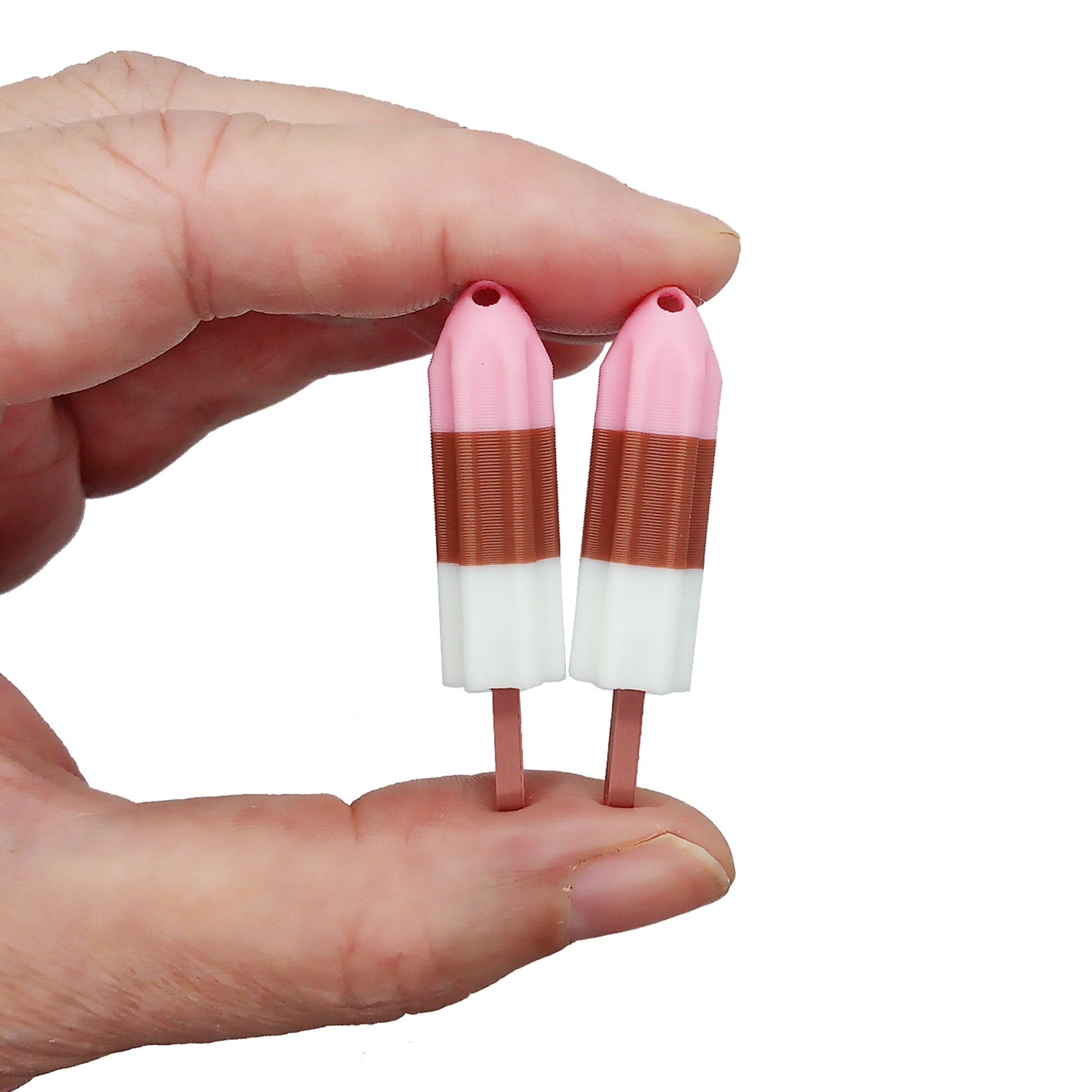 Adorable miniature freeze pop charms in Neopolitan ice cream colors.
