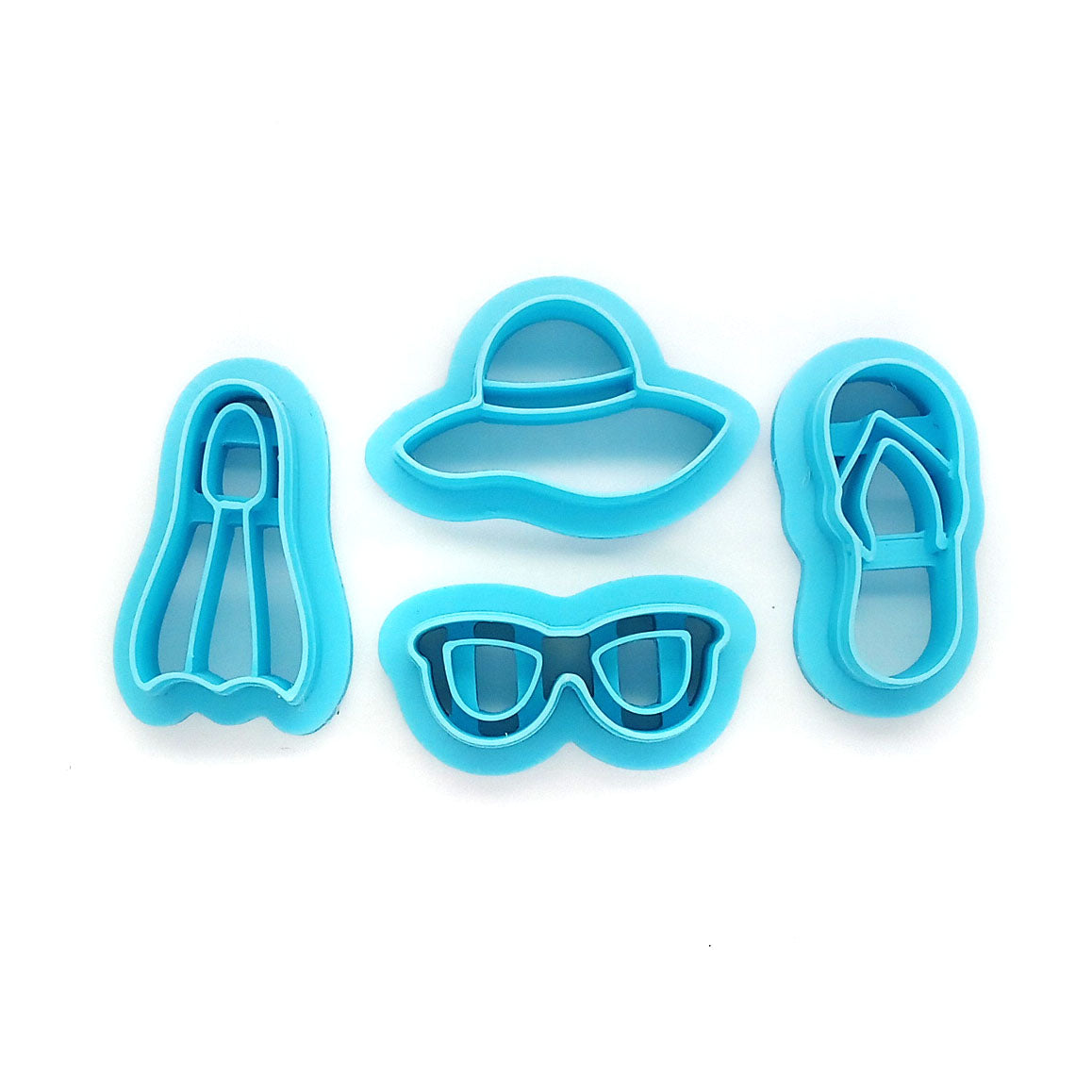Summer vacation or beach clay cutter set: flipper, flip flop, sun hat and sunglasses.