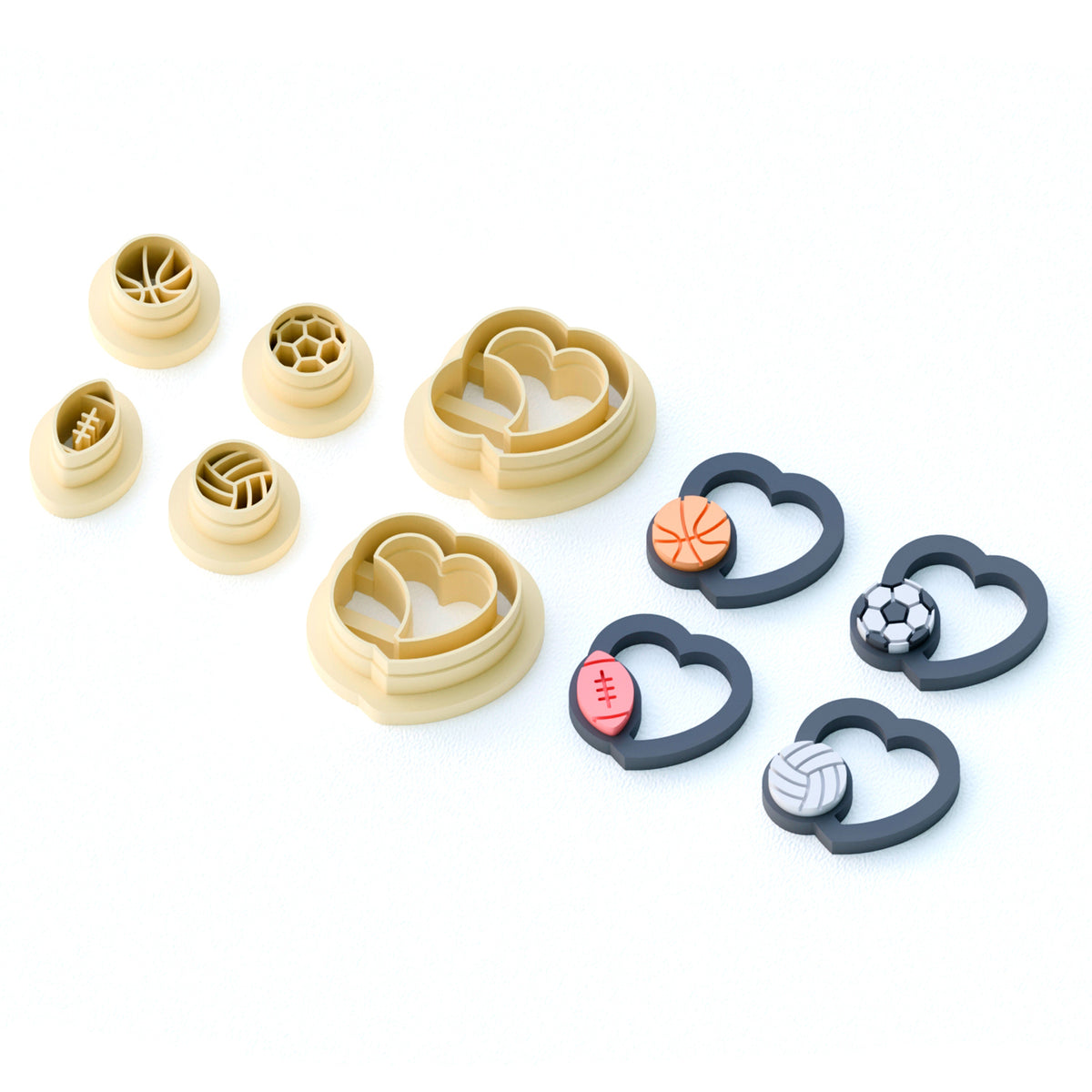 Set of clay cutters with large hearts holding sports balls
