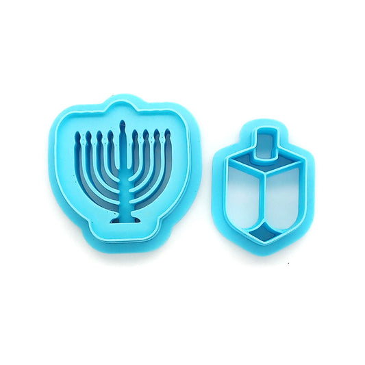 Polymer clay cutters in Hanukkah shapes: menorah and dreidl