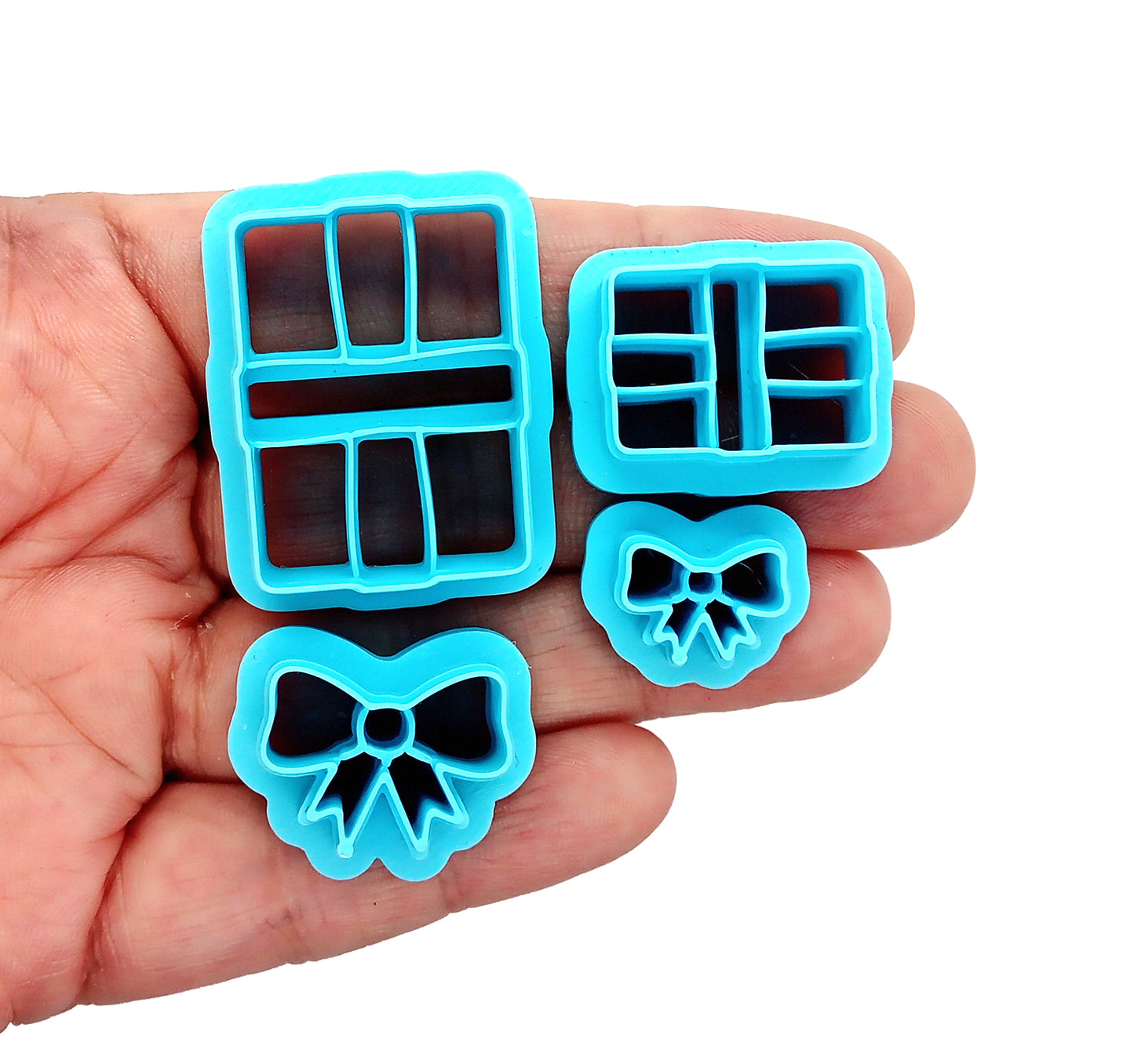 Present or gift clay cutters, held in hand.