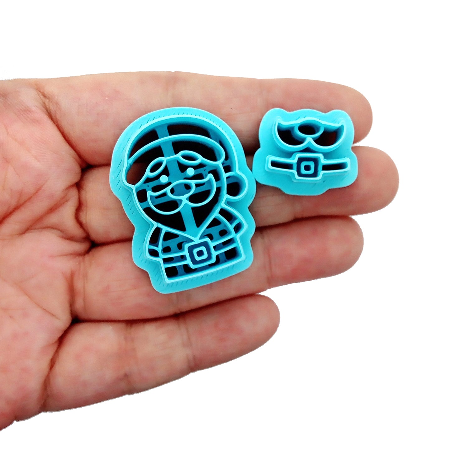 Cute Santa clay cutters set, held in hand.