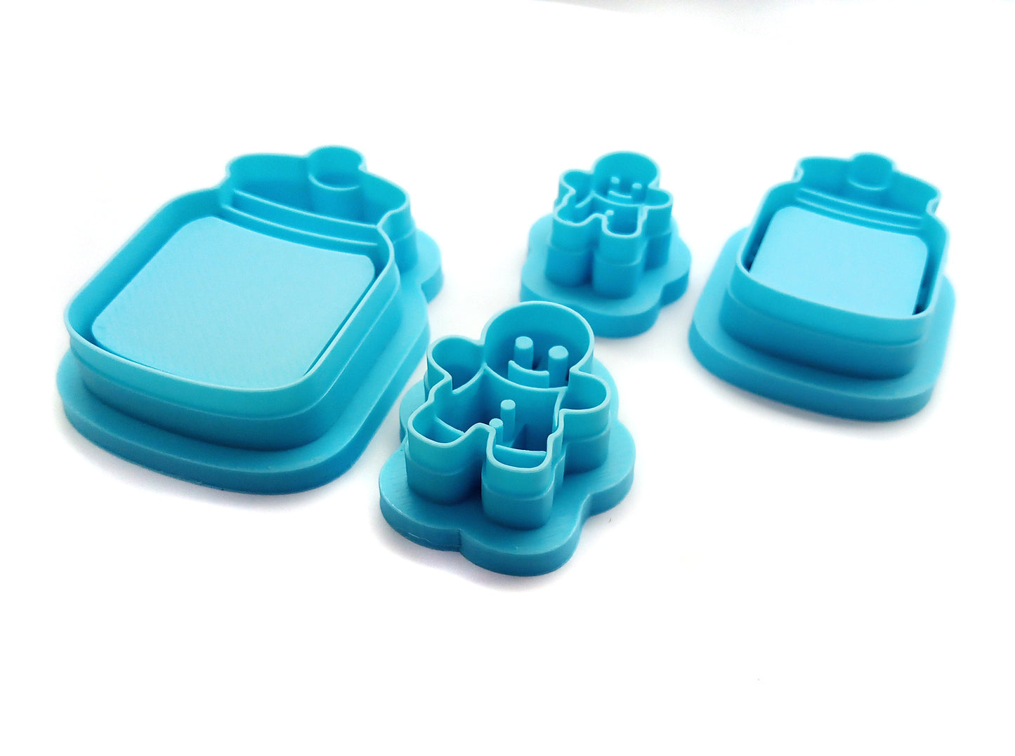 Gingerbread Man Clay Cutters with Cookie Jars, Set of 4 with sturdy sharp blades, lightweight polymer clay cutters.