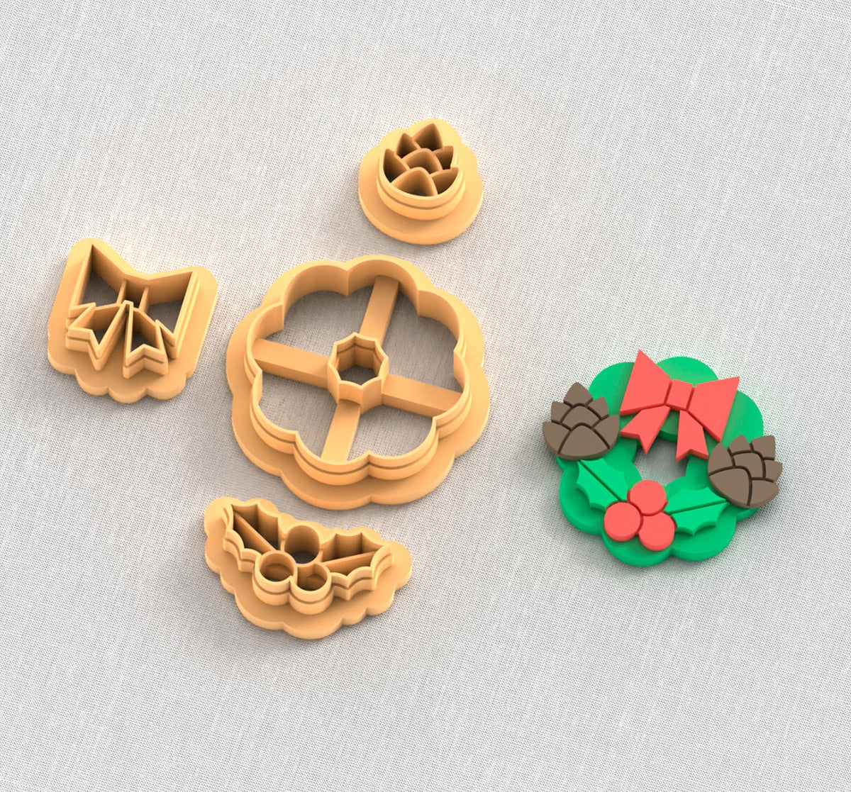 Christmas wreath with pinecones and holly polymer clay cutter set.