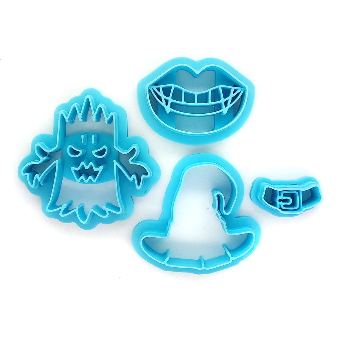 Polymer clay cutter set for Halloween: vampire fangs, witch hat and spooky tree.