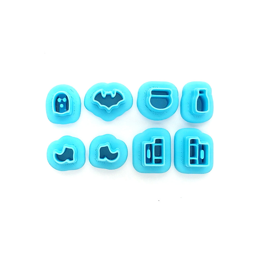 Set of tiny clay cutters in Halloween shapes: ghost, bat, potions,witch boots and spell books.