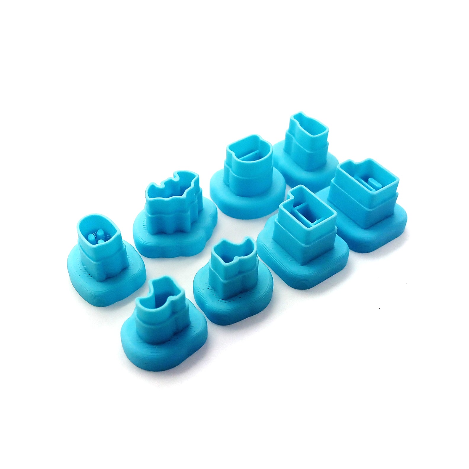 Set of tiny clay cutters in Halloween shapes: ghost, bat, potions,witch boots and spell books.