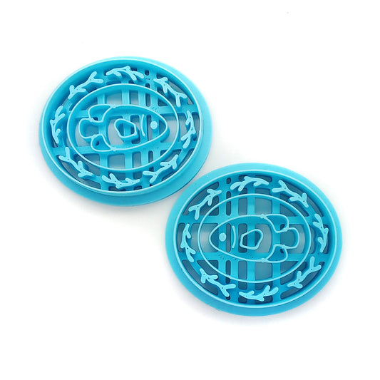 Polymer clay cutter set with fish inside a pretty frame.