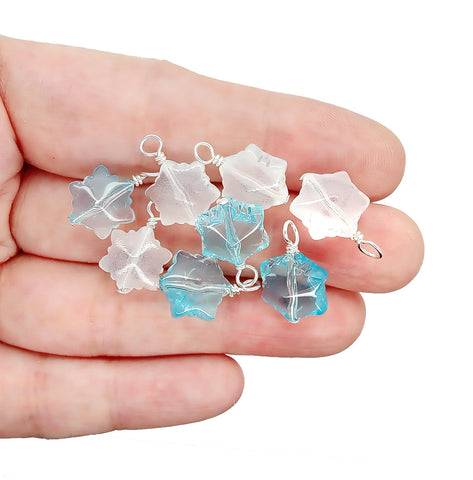 Pretty snowflake charms in blue and white made from glass beads.