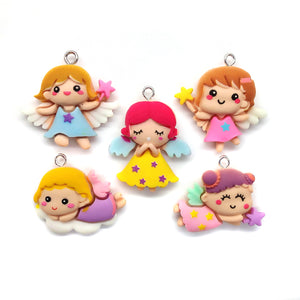 Cute angel or fairy charms made from resin flatback cabochons.