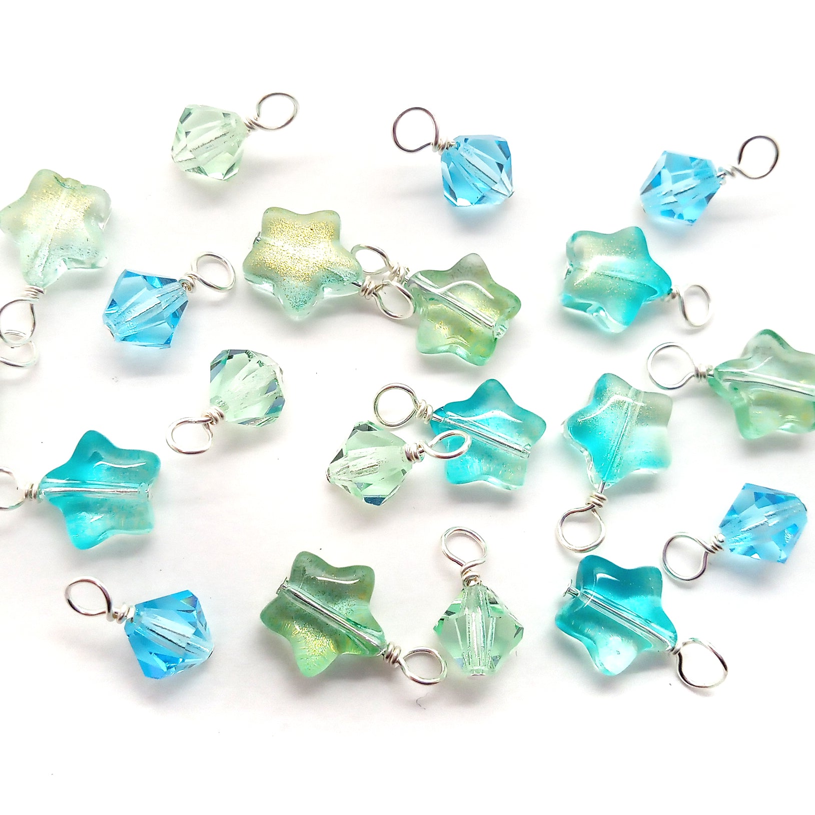 Pretty light blue and green glass star bead charms and 6mm crystal bicone dangles.