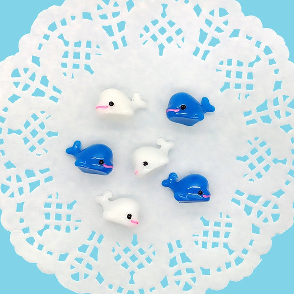 Blue and white tiny resin miniature whales.