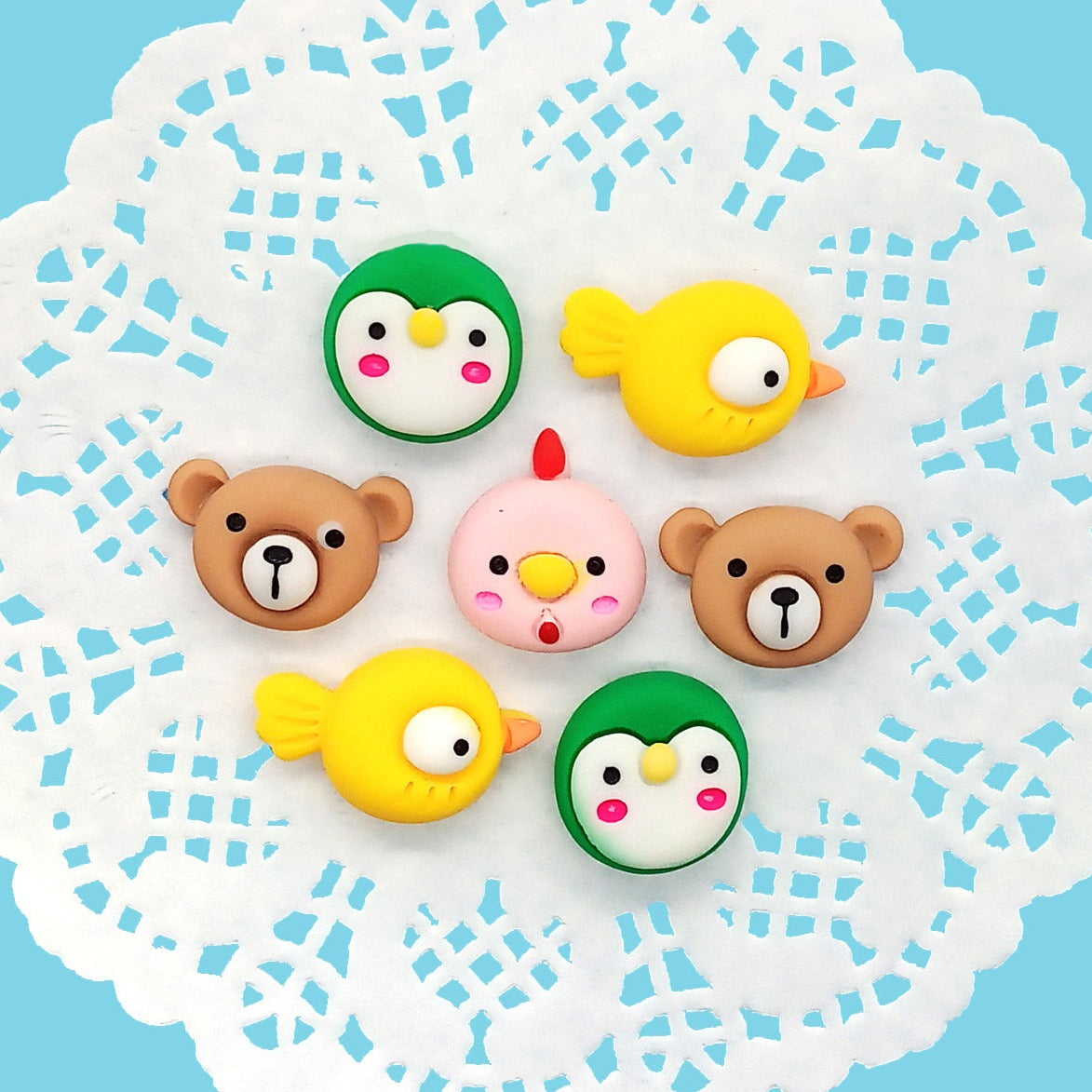 Adorable resin flatback cabochons, animal heads: bird, chicken bear and penguin.