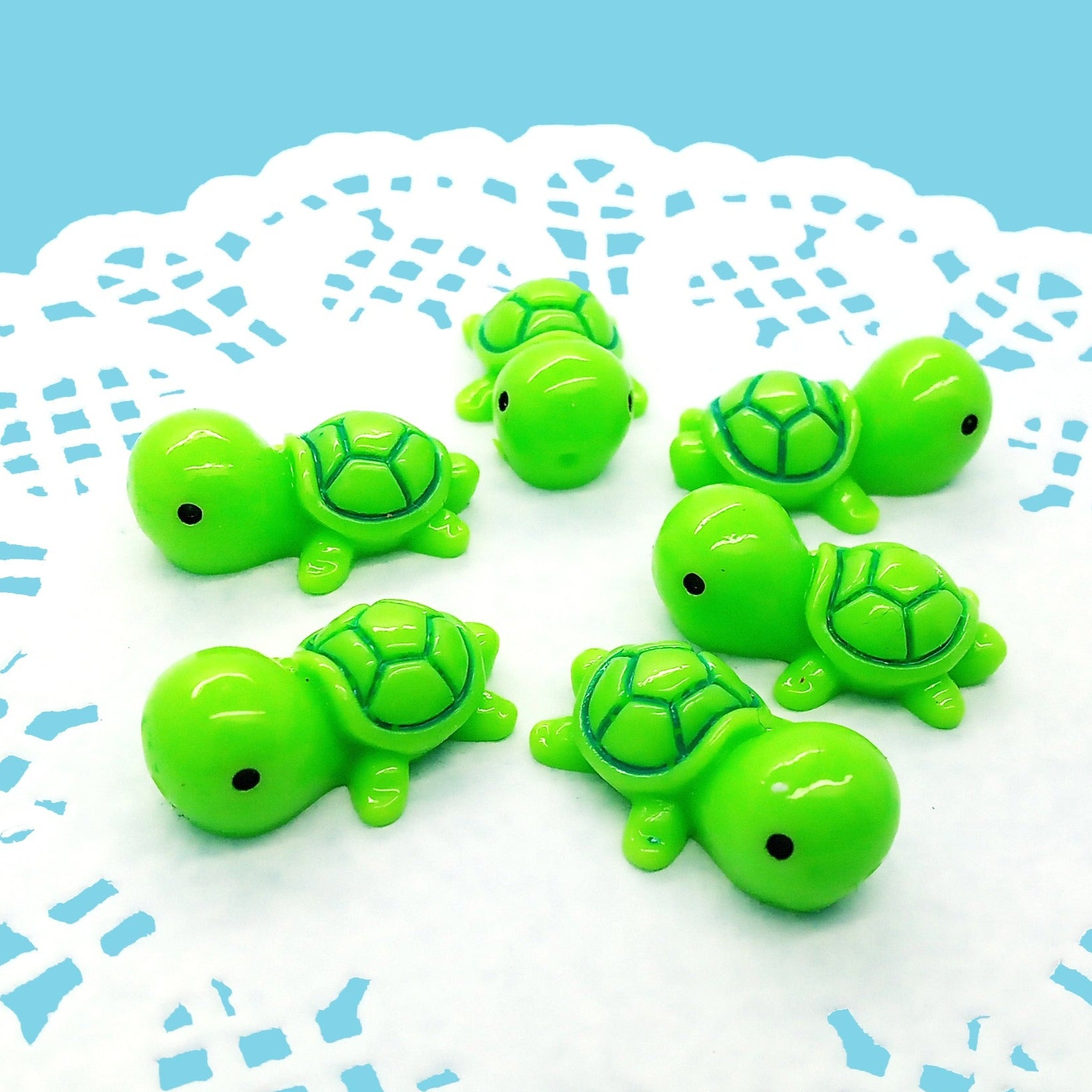 Cute tiny green turtle miniatures made of resin.