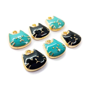 Cute cat charms in gold tone with black and turquoise enamel.