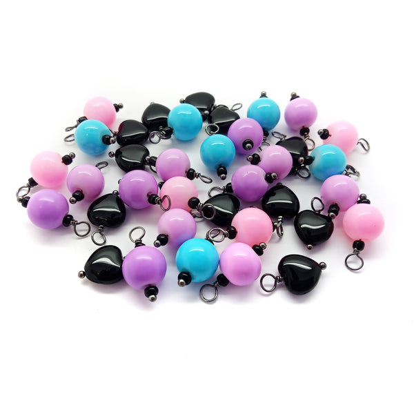 Cute pastel glass bead charms and black bead dangles for creepy cute gothic Lolita jewelry.