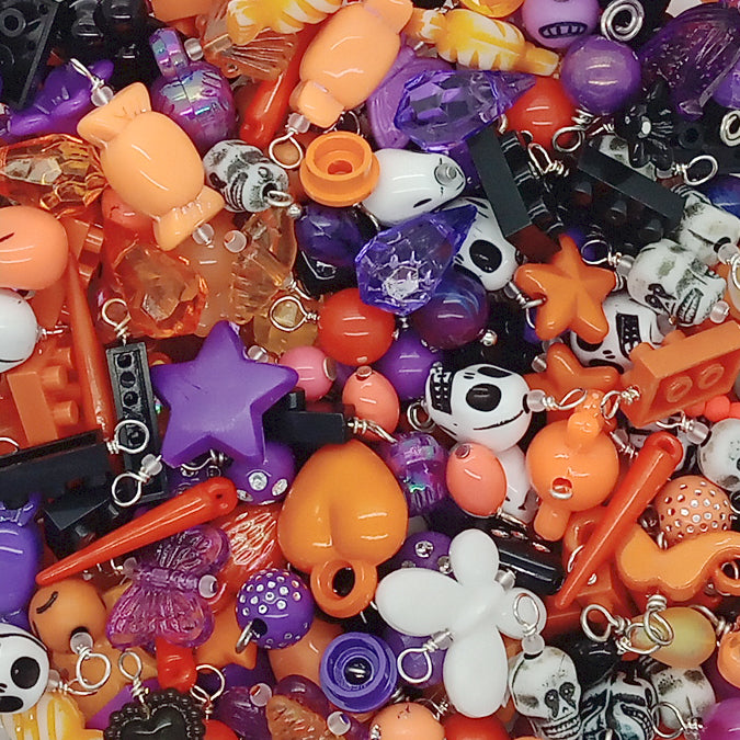 Cute acrylic charms and bead dangles in black white orange and purple for Halloween jewelry making.